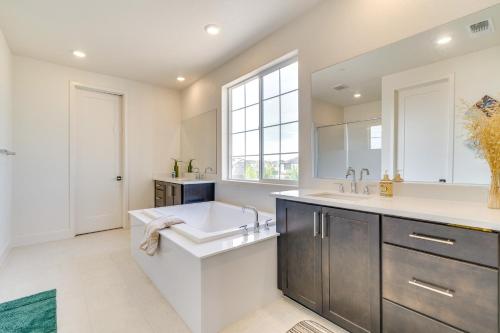 a bathroom with a large sink and a large window at Pool Paradise Spacious Tracy Home with Yard! in Tracy