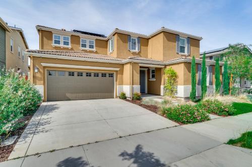a house with a driveway and a garage at Pool Paradise Spacious Tracy Home with Yard! in Tracy