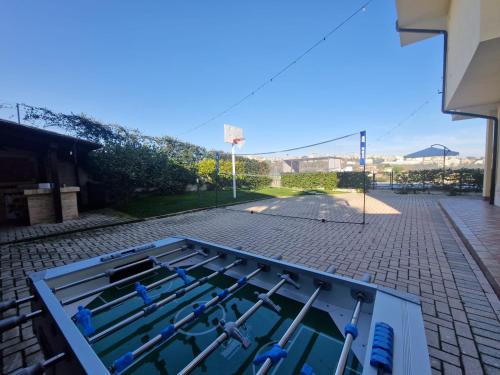 a row of paddles in a tank on a street at B&B Casa Ciarpella in Montegranaro