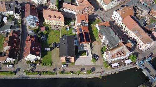 an overhead view of a city with buildings and water at Constanza in Plau am See