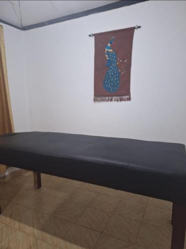 a mattress sitting on a table in front of a wall at The Hideout Sigiriya in Sigiriya