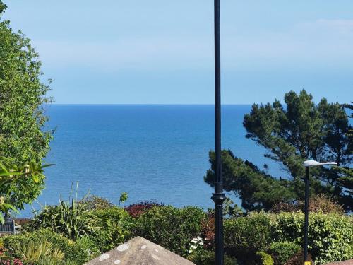 a street light with the ocean in the background at Seaside studio for business or holiday travellers in Eastbourne