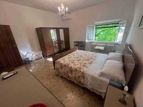 a bedroom with a bed and a window at B&B Locanda Pinà - Room 2 in Montemarciano