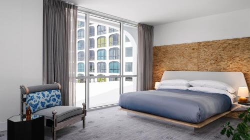 a bedroom with a bed and a large window at The LINE Austin in Austin