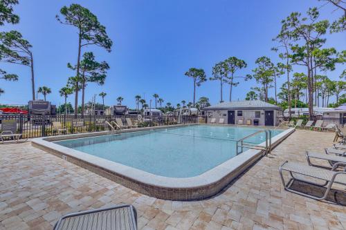 a large swimming pool with chairs and a table at Swim, Fish and Play Pet-Friendly Gem in Fort Myers in Fort Myers
