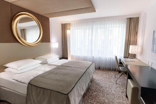Katil atau katil-katil dalam bilik di Vier Jahreszeiten Kempinski München