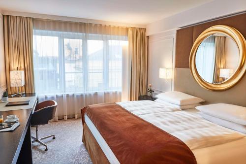 Katil atau katil-katil dalam bilik di Vier Jahreszeiten Kempinski München