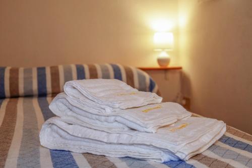 Postel nebo postele na pokoji v ubytování Casa Vacanze Enzo Capoliveri