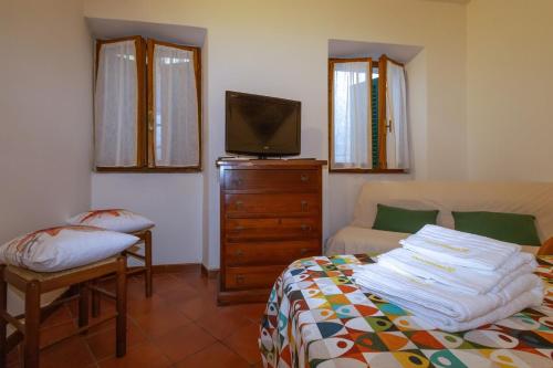 Ένα ή περισσότερα κρεβάτια σε δωμάτιο στο Casa Vacanze Enzo Capoliveri