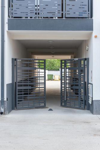 an entrance to a building with a gate at L & S Apartmani in Sombor