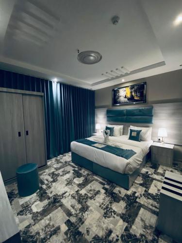 Katil atau katil-katil dalam bilik di زهرة الربيع للشقق المخدومة zahrat alrabie Hotel