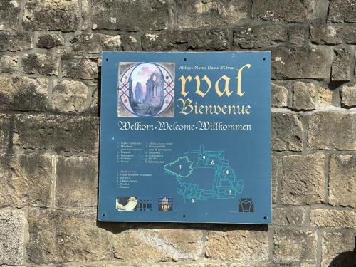 a sign on the wall of a building at Le Bocard in Abbaye dʼOrval