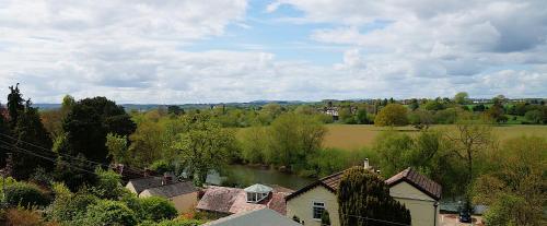 an aerial view of a village with a river at Radcliffe Guest House in Ross on Wye