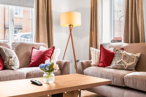 a living room with two couches and a coffee table at 247 Serviced Accommodation in Telford 4BR House in Telford