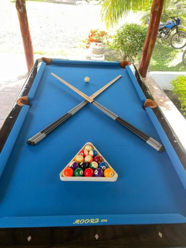a pool table with cue balls on top of it at Hotel Boutique Victoria in Moyogalpa