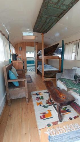 a room with two bunk beds and a rug at El Destino in San Marcos La Laguna