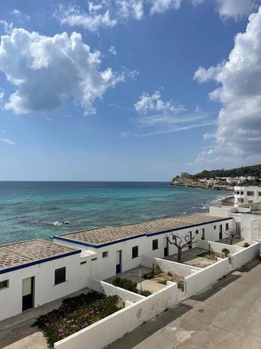 a view of the ocean from a building at Panoramico Appartamento Lido Conchiglie in Gallipoli