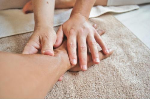 a group of people placing their hands on top of each other at Gaarten Hotel Benessere Spa by Kleos Group Collection in Gallio
