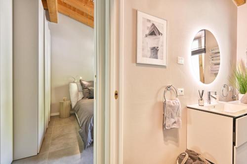 a bathroom with a sink and a mirror at Apartment Monti e Lago - Tignale in Tignale