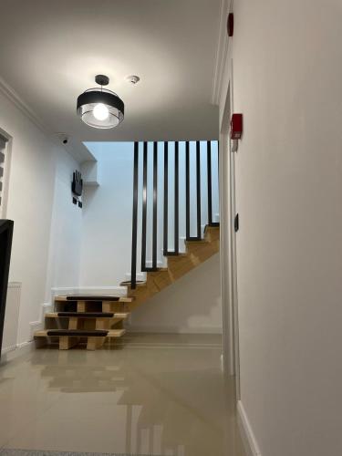 a hallway with a staircase in a house at AGM Home in Cajvana