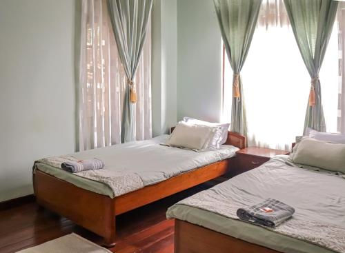 Ένα ή περισσότερα κρεβάτια σε δωμάτιο στο The LYNMAR HOMESTAY at Mawkynroh