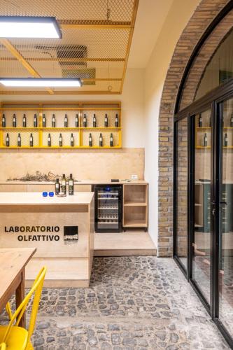 a kitchen with a counter with alcohol bottles at Villa Cavalletti in Grottaferrata