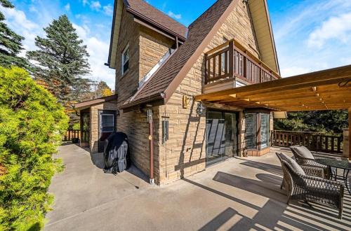 a house with a patio with a grill on it at Mono Farmhouse in Caledon