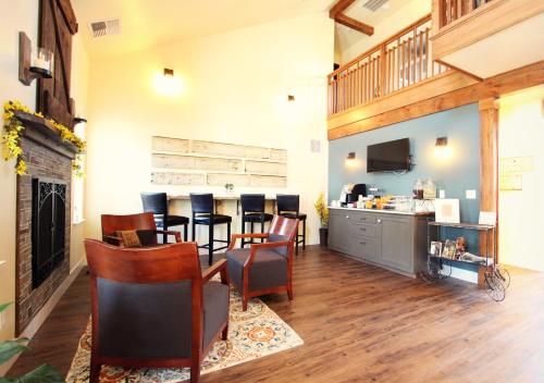 a restaurant with a bar with chairs and a counter at Rest, a boutique hotel in Plymouth