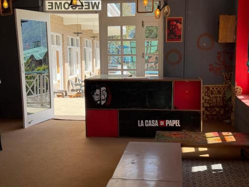 a room with a table and a podium in front of a door at Hotel The Premium Villa Old Manali View in Manāli