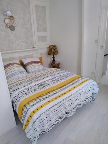 Ένα ή περισσότερα κρεβάτια σε δωμάτιο στο gite iza