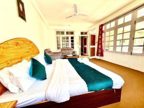 a large bedroom with a large bed in a room at Hotel The Premium Villa Old Manali View in Manāli