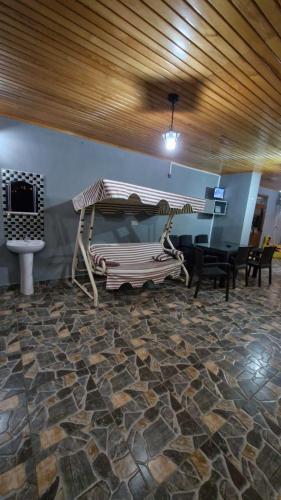 a room with a bed and a table and chairs at Sumgayit apart in Cayeli