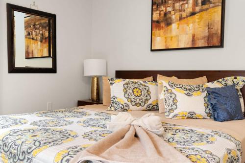 a bedroom with a large bed with pillows at Spacious Game Room Seclusion Hot Tub and more in Long Pond