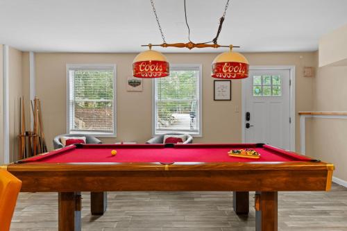 a pool table in a living room with at Spacious Game Room Seclusion Hot Tub and more in Long Pond