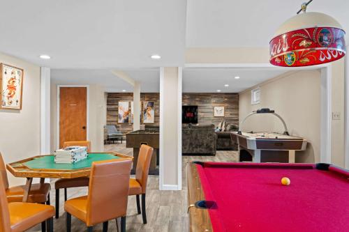 a living room with a pool table and a dining room at Spacious Game Room Seclusion Hot Tub and more in Long Pond