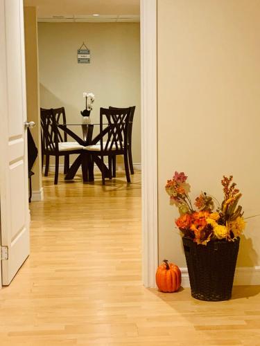a pumpkin sitting on the floor in a hallway with a dining room at Finished 2 BR Apartment in an Upscale Area of Ajax in Ajax