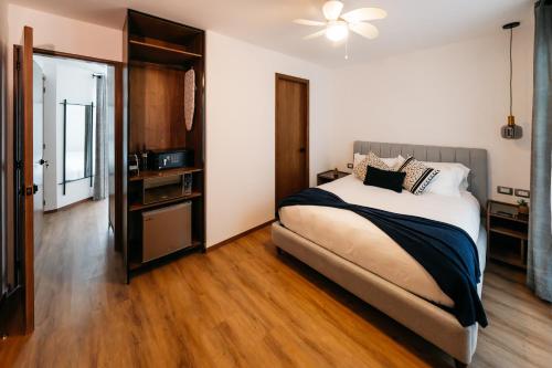 a bedroom with a bed and a ceiling fan at Casa Castillo Condesa in Mexico City