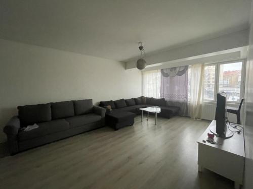 a living room with a couch and a tv at Kivimiehenkatu 4 in Kouvola