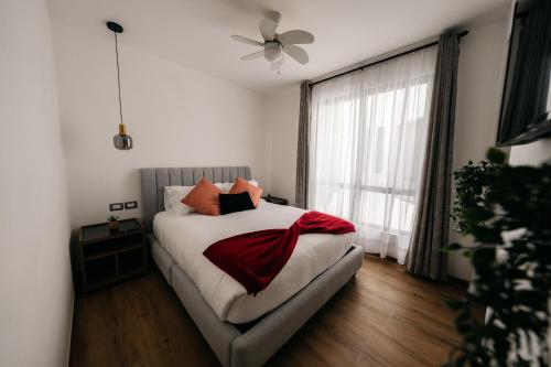 a bedroom with a bed and a large window at Casa Castillo Condesa in Mexico City