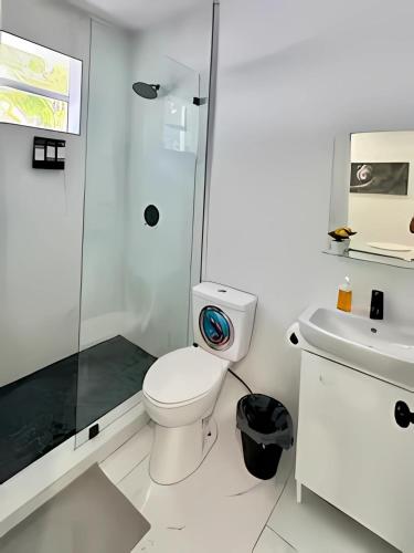 a bathroom with a shower and a toilet and a sink at Cute Private Room - Close to airport & Free parking 01 in Miami