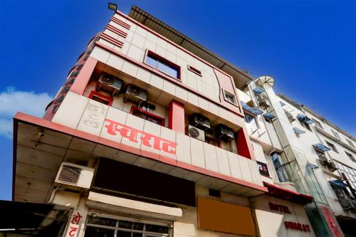 a building with air conditioners on the side of it at SPOT ON Hotel Swarat in Satna