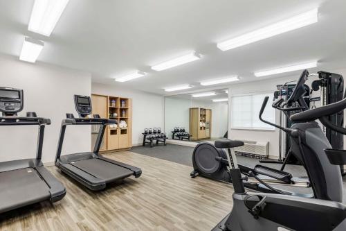 a gym with treadmills and ellipticals in a room at Sonesta Simply Suites Baltimore BWI Airport in Linthicum Heights