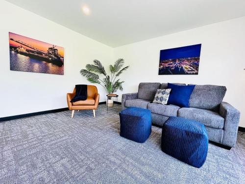 a living room with a couch and a chair at The 419 Ten-room Boutique In Sandusky in Sandusky