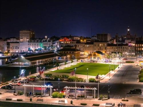 a city at night with a green park with lights at The 419 Ten-room Boutique In Sandusky in Sandusky