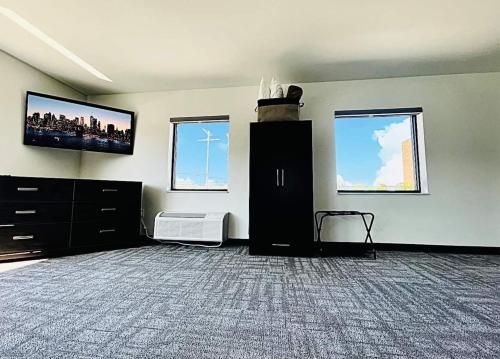 a living room with a flat screen tv on the wall at The 419 Ten-room Boutique In Sandusky in Sandusky