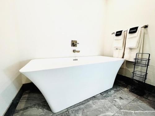 a bathroom with a white sink in a room at The 419 Ten-room Boutique In Sandusky in Sandusky