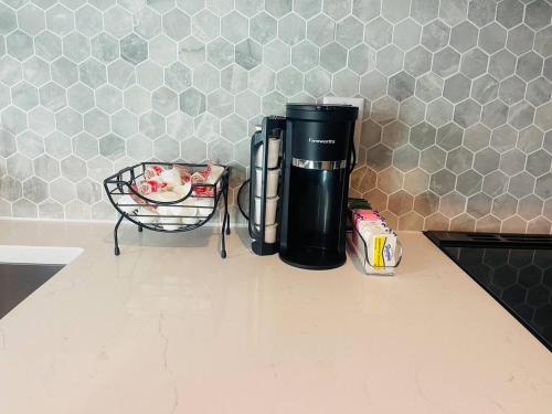 a coffee maker sitting on a counter in a kitchen at The 419 Ten-room Boutique In Sandusky in Sandusky