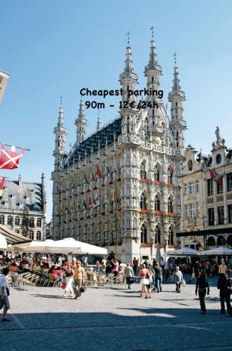 a large building with people standing in front of it at Cosy Boutique hotel leuven - self check in with airco !!! in Leuven