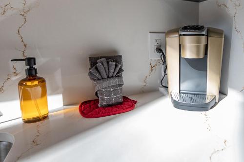 a kitchen counter with a soap dispenser and a sink at Oak Hollow in McArthur