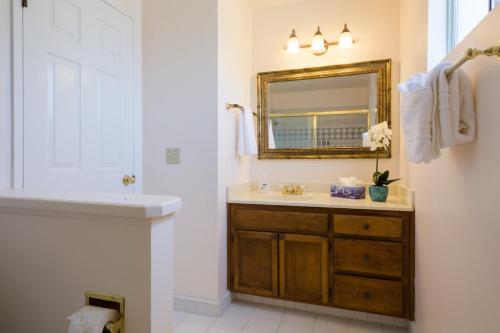 a bathroom with a sink and a mirror at The Sonoma Grape Escape 4 BD and 2,5BA Wineries Nearby in Sonoma